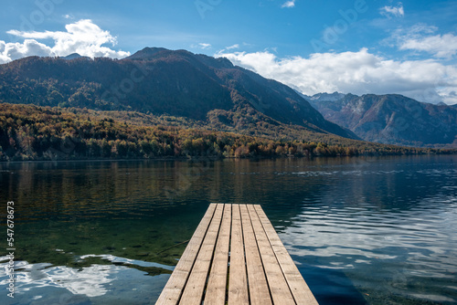 Scenic view of a small wooden jetty at lake Bohinj in the Triglav National Park, The Julian Alps of Slovenia