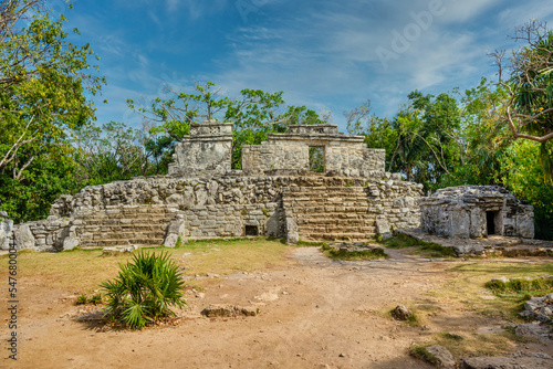 Mayan ruins in shadow of trees in jungle tropical forest Playa del Carmen, Riviera Maya, Yu atan, Mexico