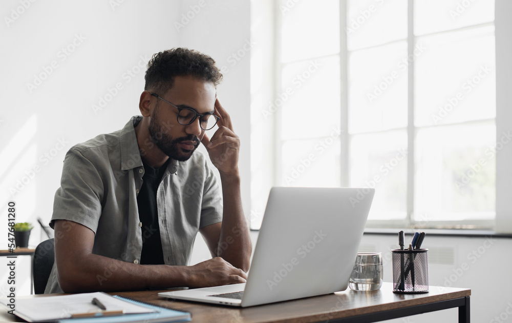 Stressed man professional sitting at office workplace, Tired and overworked businessman, Young exhausted student men in stress working laptop computer Stressed man professional sitting at office workplace, Tired and overworked businessman, Young exhausted student men in stress working laptop computer