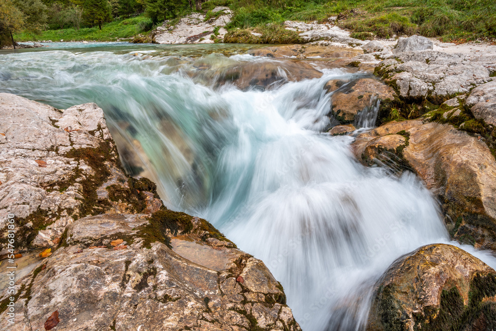 The Soca river flowing through a wild mountain landscape of the Julian Alps in Slovenia The Soca river flowing through a wild mountain landscape of the Julian Alps in Slovenia