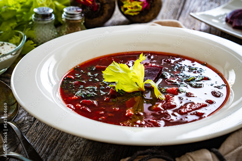 Borsch - beetroots soup on wooden table
