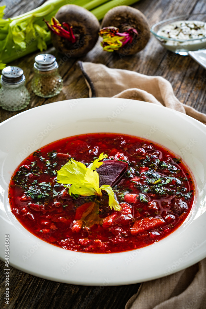 Borsch - beetroots soup on wooden table
Borsch - beetroots soup on wooden table