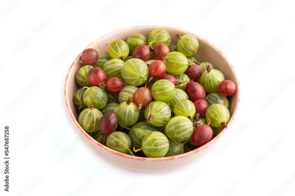 Fresh red and green gooseberry in ceramic bowl isolated on white, side view. Fresh red and green gooseberry in ceramic bowl isolated on white, side view.