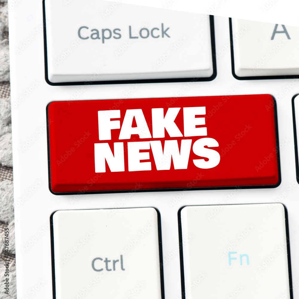 FAKE NEWS red button of computer keyboard. FAKE NEWS red button of computer keyboard.