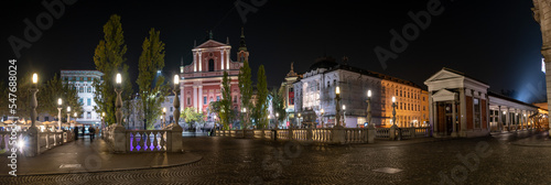 Famous Three Bridges and the Preseren square in the center of Ljubljana illuminated at night photo