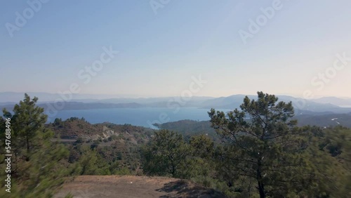 Beautiful seashore. Islands in the distance. Colorful blue sea. The beauty of Turkey. Beautiful rocks and mountains. Sunny clear day. Beautiful water.