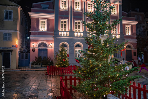 Fototapeta Naklejka Na Ścianę i Meble -  CORFU, GREECE - December 10, 2021:  photo of illuminated festive view in corfu town and Christmas fair and market,Greece.