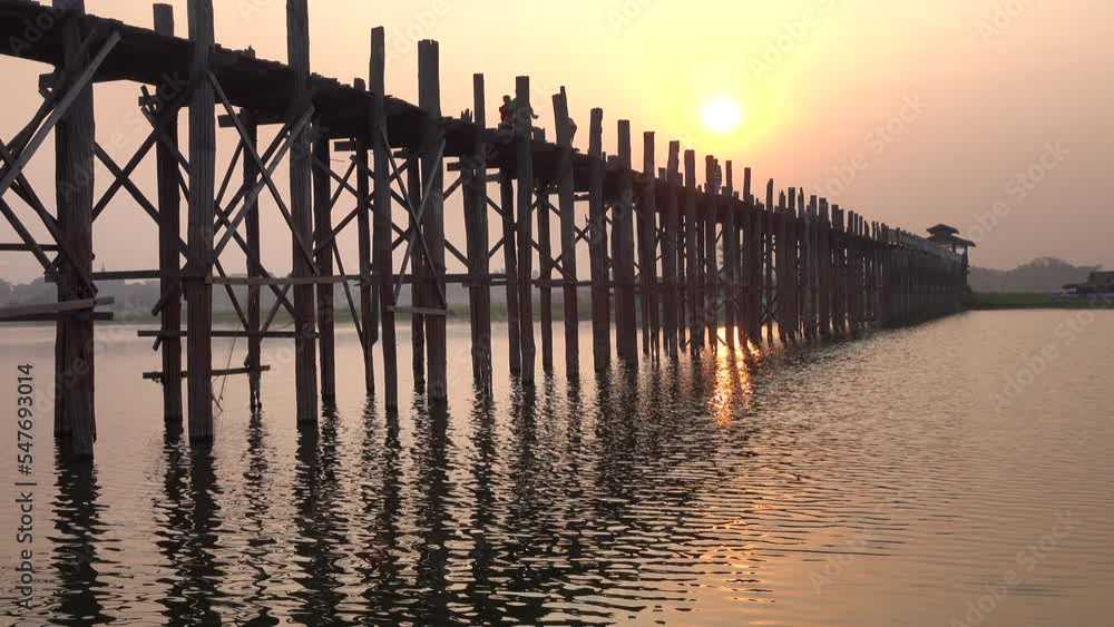 U Bein bridge teakwood on the sunrise lake in Myanmar. U Bein bridge teakwood on the sunrise lake in Myanmar.