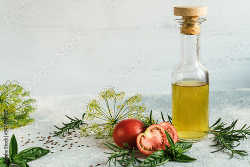 Obraz na plátně fresh vegetable oil from spicy aromatic herbs for salad dressing and tomatoes 7