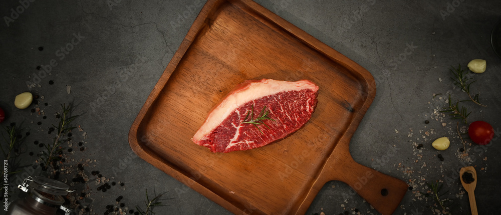 Picanha raw beef steak on wooden cutting board