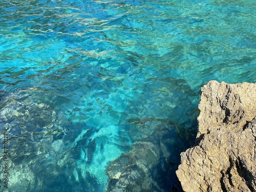 Sea azure blue deep water and rocks.