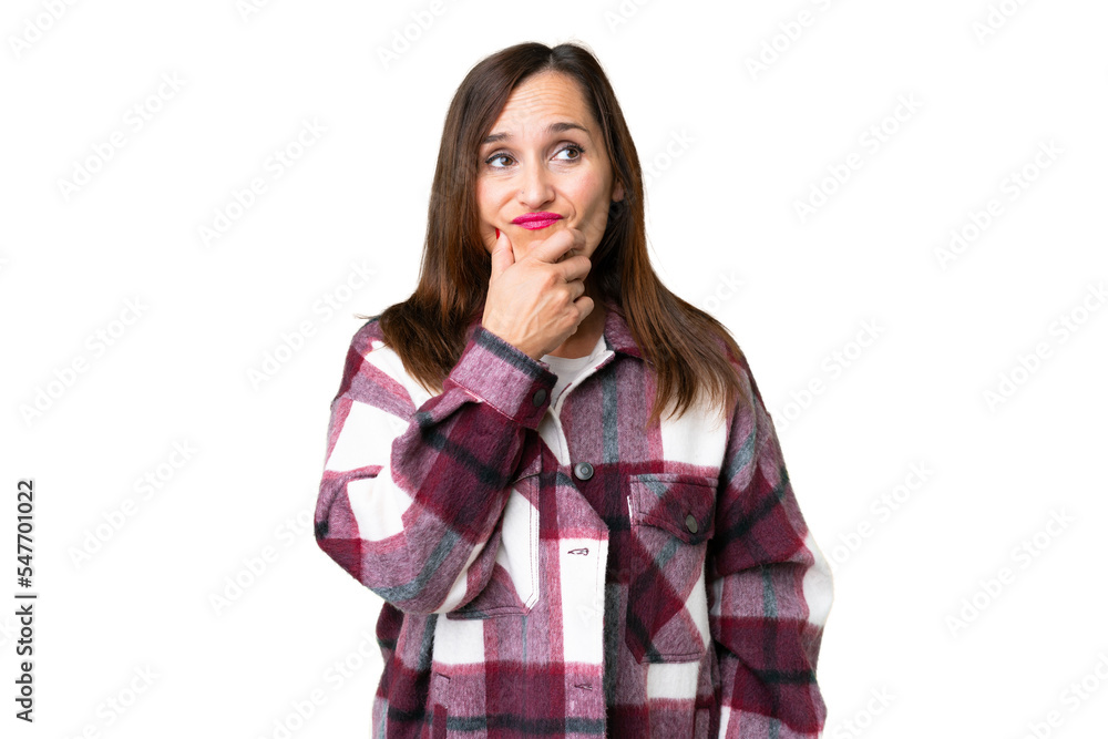Middle age woman over isolated chroma key background having doubts Middle age woman over isolated chroma key background having doubts