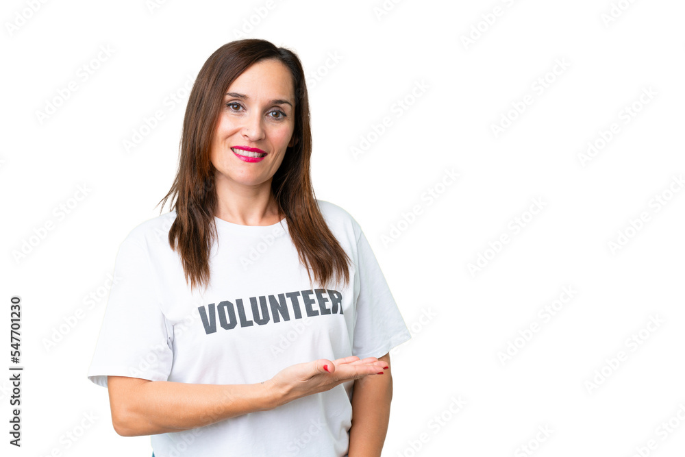 Middle age volunteer woman over isolated chroma key background presenting an idea while looking smiling towards Middle age volunteer woman over isolated chroma key background presenting an idea while looking smiling towards