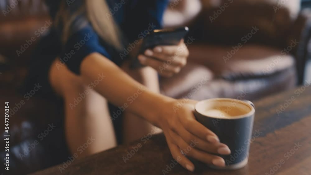 Closeup of young woman with smartphone enjoying coffee in cafe, leisure time Closeup of young woman with smartphone enjoying coffee in cafe, leisure time