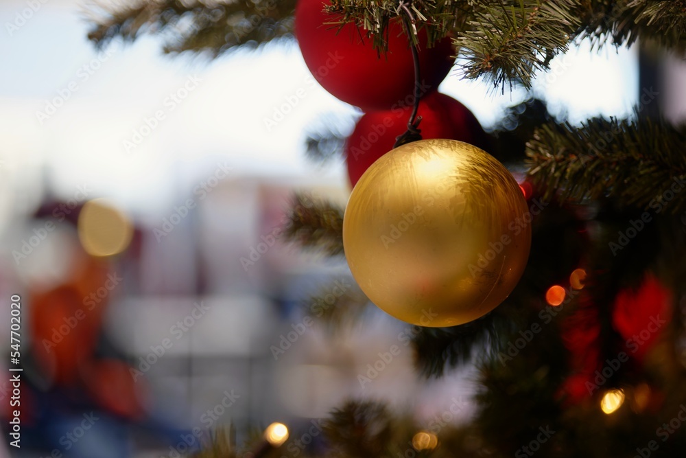 Ornaments and lights on the decorated Christmas tree. Colorful balls