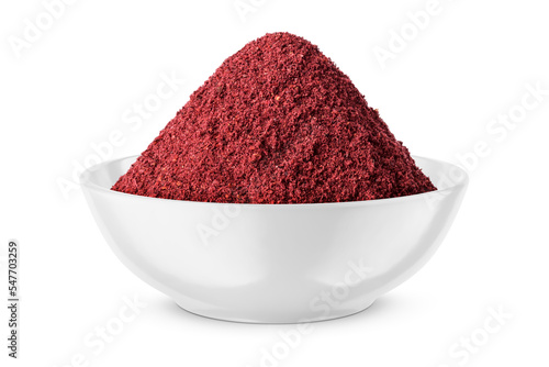 Fotografie Dry ground sumac in white bowl isolated on white. Front view.