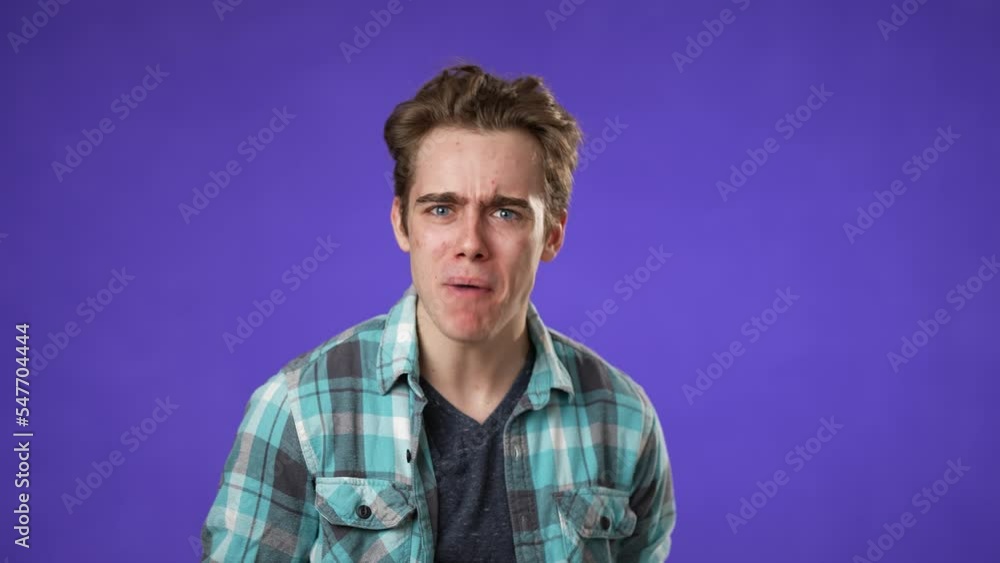Portrait of excited, surprised smiling young hipster man 20s gives thumbs up smiling isolated on purple background studio Portrait of excited, surprised smiling young hipster man 20s gives thumbs up smiling isolated on purple background studio