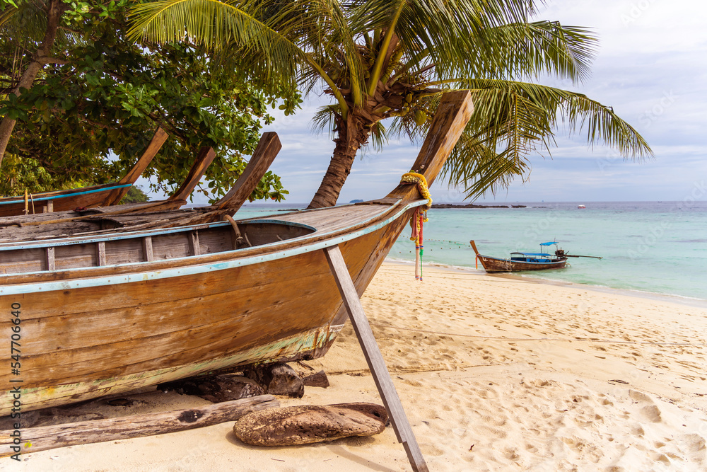 Traditional Thai boats on the beach near ocean Traditional Thai boats on the beach near ocean