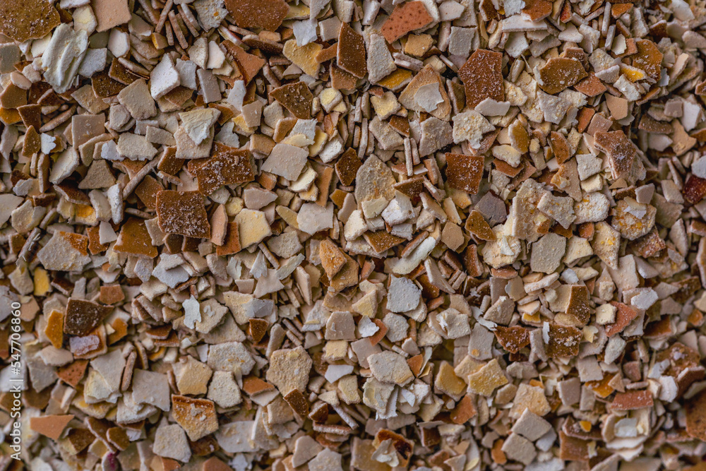 Used crashed chicken eggshell used as a fertiliser for plants, flowers and tomatoes. Change from littering Into storage and processing, home made organic fertilizer. Nature background texture Used crashed chicken eggshell used as a fertiliser for plants, flowers and tomatoes. Change from littering Into storage and processing, home made organic fertilizer. Nature background texture