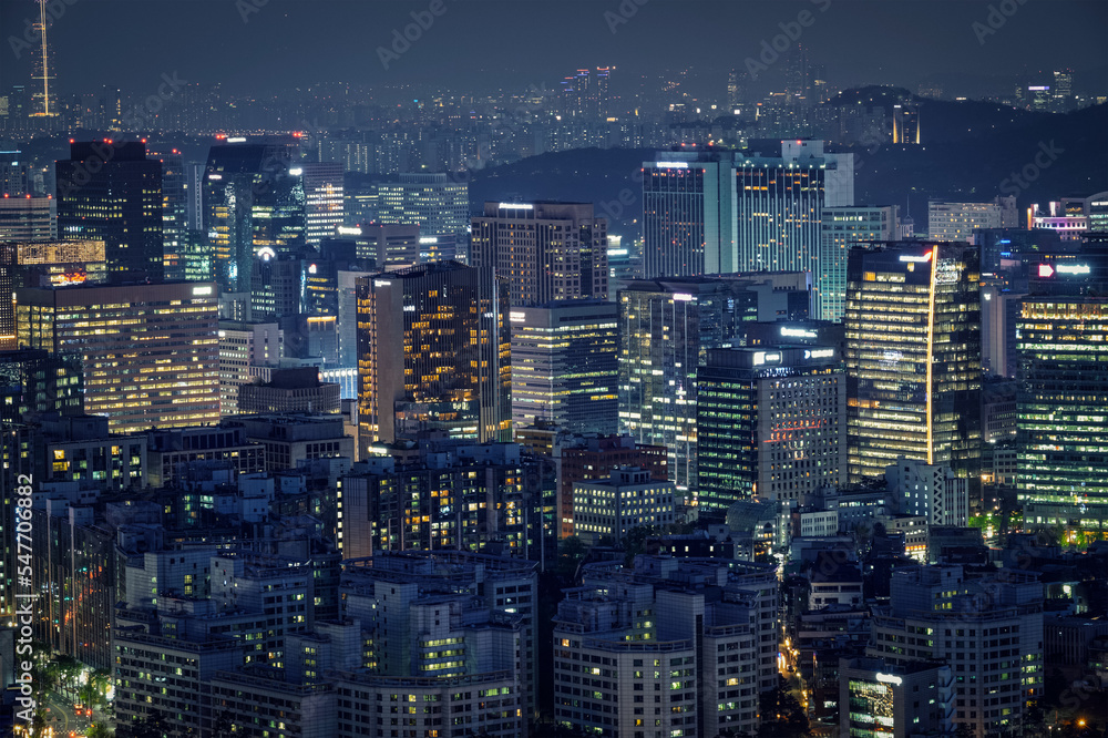 Obraz premium Seoul skyscrapers illuminated with lights view from Inwang mountain. Seoul, South Korea.