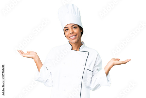 Young African American chef over isolated chroma key background having doubts while raising hands