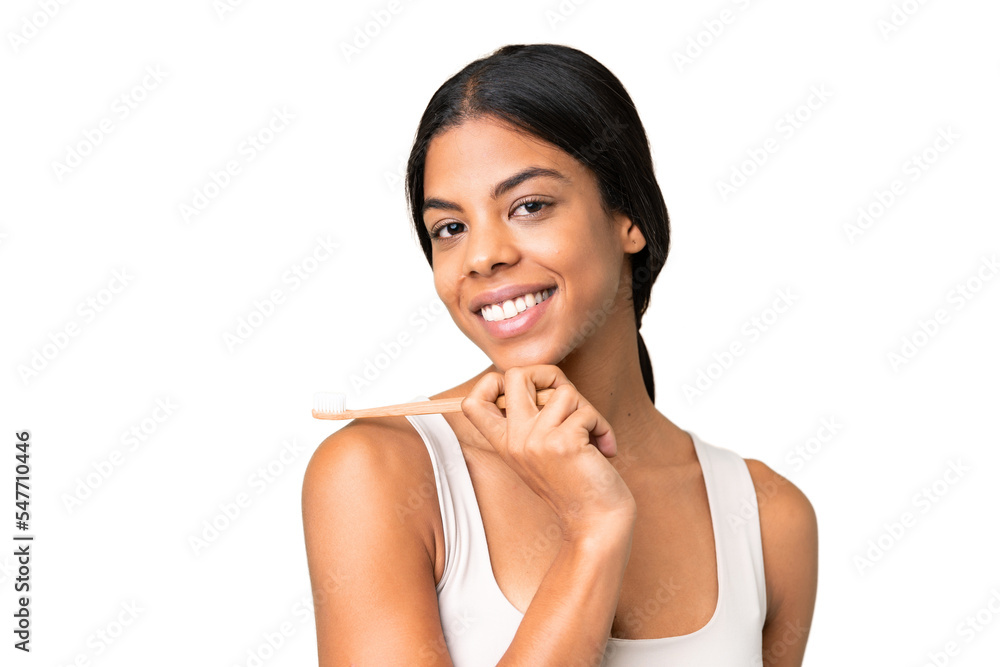 Young woman over over isolated chroma key background with a toothbrush and happy expression Young woman over over isolated chroma key background with a toothbrush and happy expression