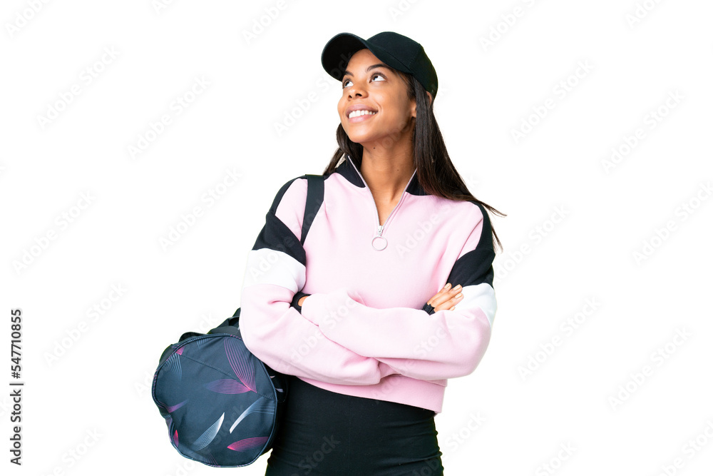 Young sport African American woman with sport bag over isolated chroma key background looking up while smiling Young sport African American woman with sport bag over isolated chroma key background looking up while smiling