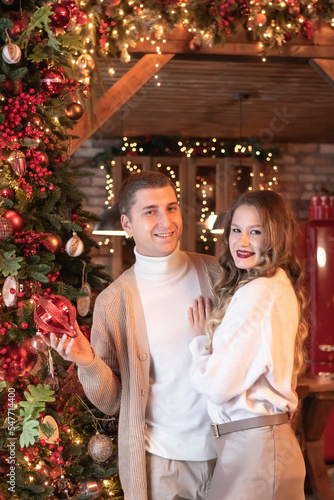 young couple celebrates new year at home. christmas concept