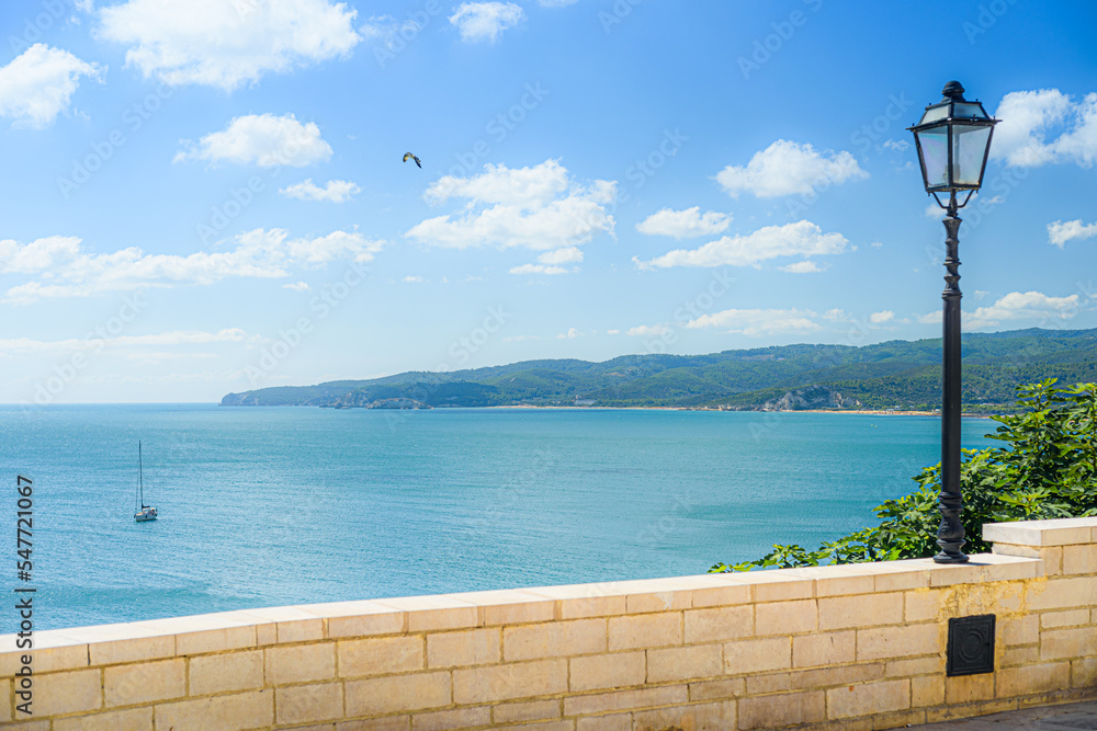 Vieste, Italy. View of the bay of Vieste from a panoramic point with a lamppost, in the center of the Gargano town. September 5, 2022.