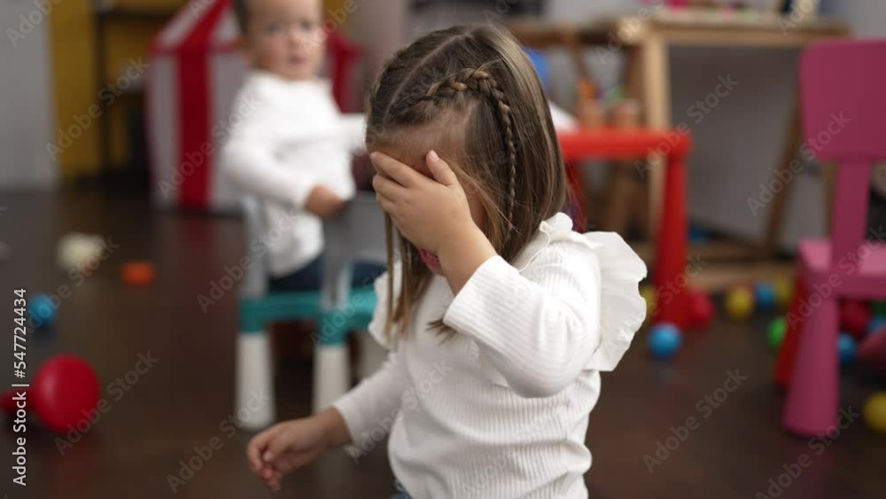 Adorable girl and boy crying at kindergarten Adorable girl and boy crying at kindergarten