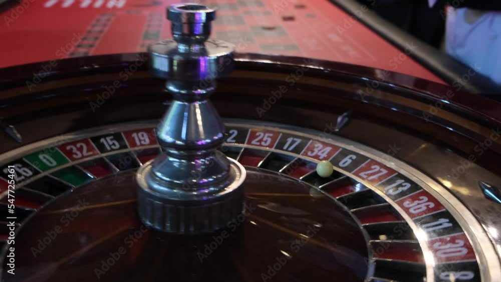 The ball jumps on the roulette table in the casino The ball jumps on the roulette table in the casino