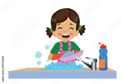 cute happy boy washing dishes