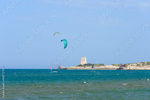 Vieste, Italy. From the Scialmarino beach the trabucco of the Tufara Bay and the Porticello Tower. Summer day along the coast of Vieste. September 7, 2022 photo