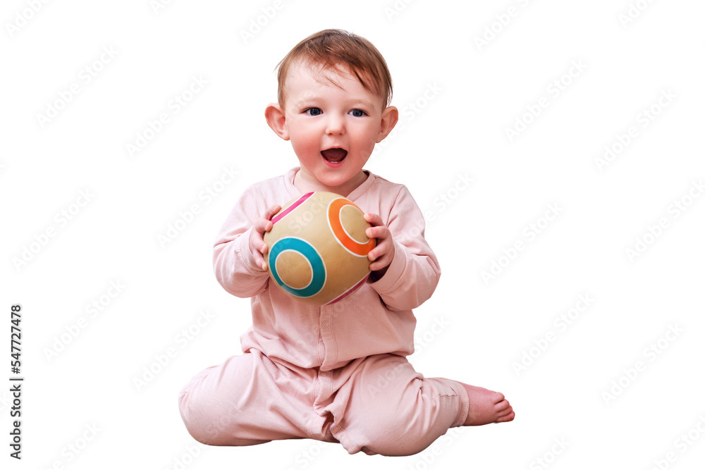 Happy toddler baby boy throws a ball with his hands while sitting on the floor in the home room, isolated on a white background. A child aged one year Happy toddler baby boy throws a ball with his hands while sitting on the floor in the home room, isolated on a white background. A child aged one year