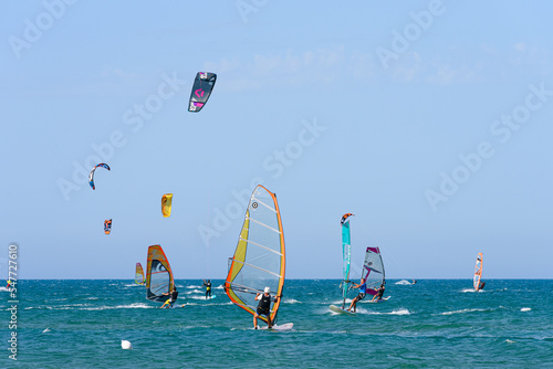 Vieste, Italy. In the sea of Vieste, near the Scialmarino beach, some people practice windsurfing and others practice kitesurfing. September 7, 2022