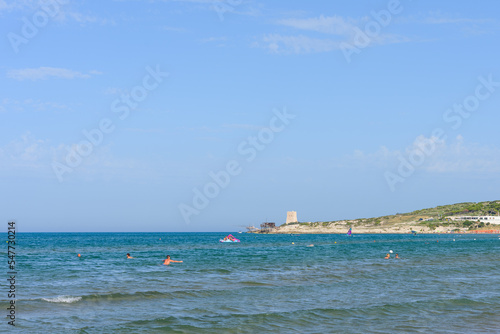 Vieste, Italy. From the Scialmarino beach the trabucco of the Tufara Bay and the Porticello Tower. Summer day along the coast of Vieste. September 7, 2022