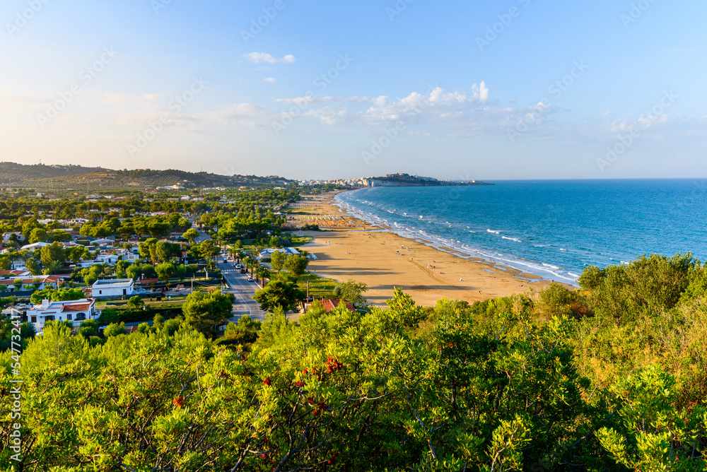 Vieste, Italy. View of Pizzomunno beach with the town of Vieste far in the background. September 9, 2022. Vieste, Italy. View of Pizzomunno beach with the town of Vieste far in the background. September 9, 2022.