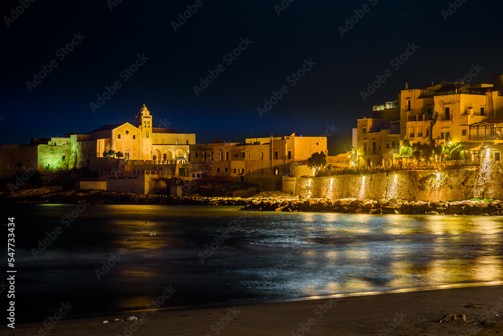 Vieste, Italy. Night view of the historic center of Marina Piccola. In the distance the Church of San Francesco. September 9, 2022.
