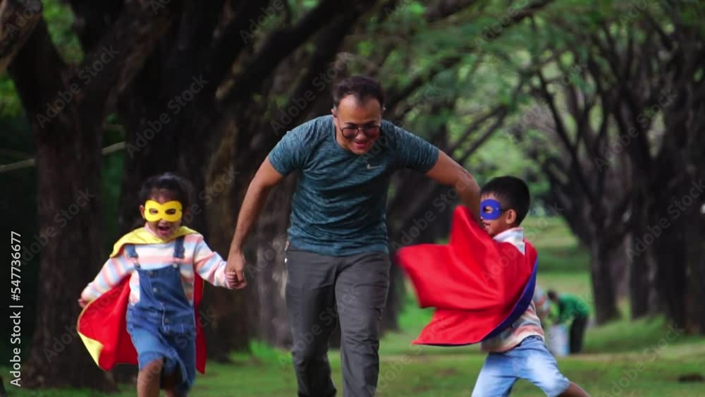 The children were happily playing with their father in the park The children were happily playing with their father in the park