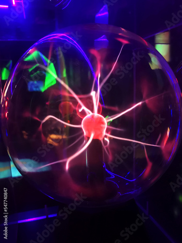 Plasma ball with electric discharges in a dark room