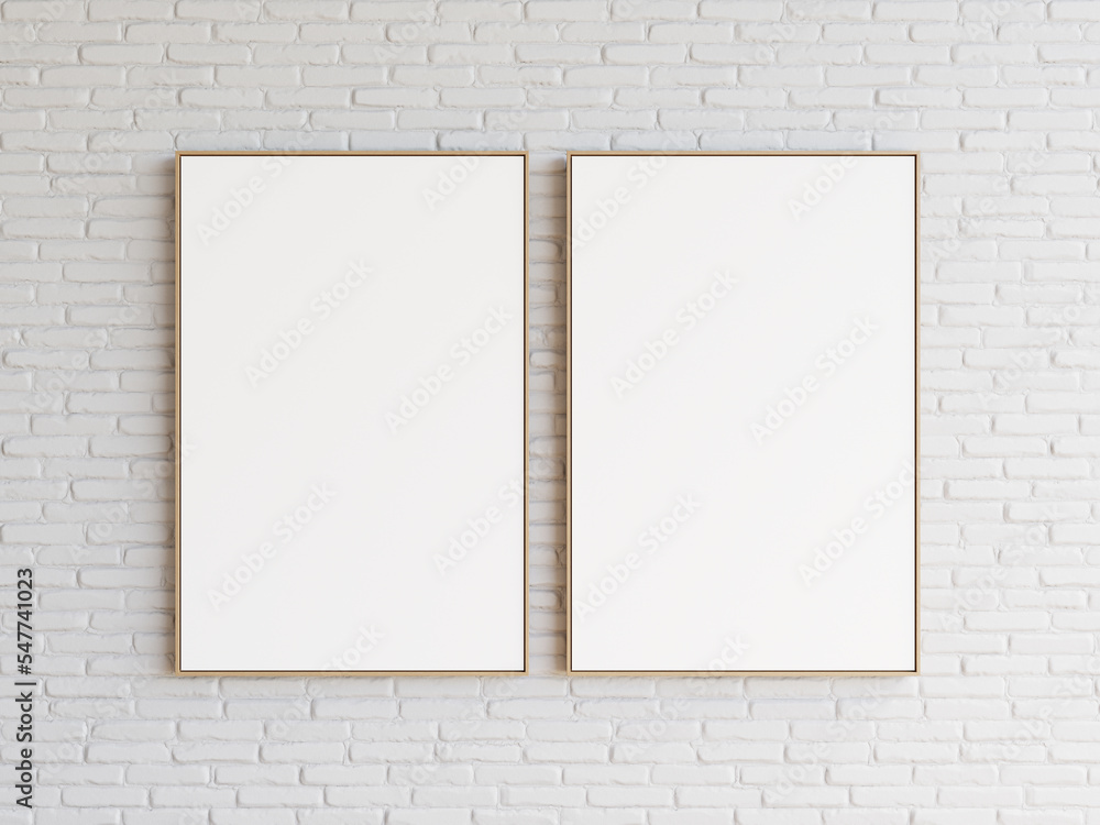 Minimalist decoration of two empty white frames hanging side by side on