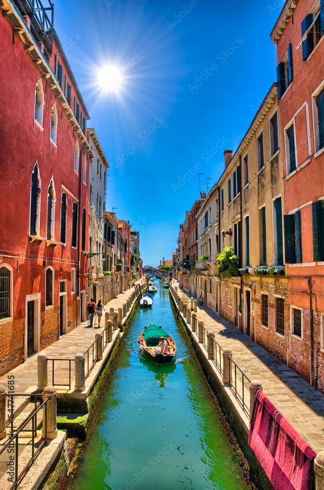 Scenic canal with boats, Venice, Italy, HDR