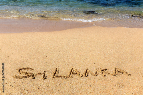 Sri Lanka written in a sandy