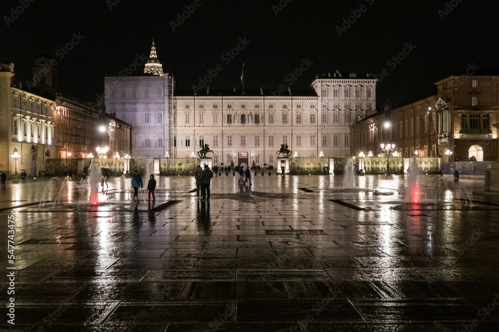 Naklejka premium The beautiful Castle Square in Turin with the Royal Palace illuminated at night