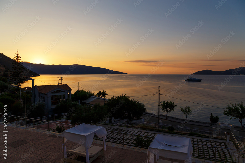Fototapeta premium Sunrise at greek island. Beautiful view at Agia Efimia bay early at the morning, Cephalonia island, Greece.