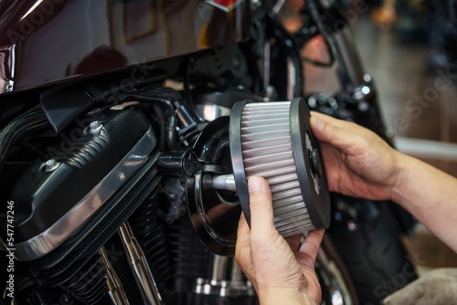 mechanic check  Motorcycle air filter in garage, Backing plate promotes smooth airflow . motorcycle maintenance,repair concept photo