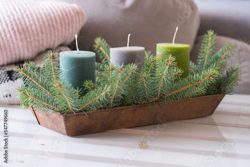 Christmas decoration with candles and fir twigs. photo