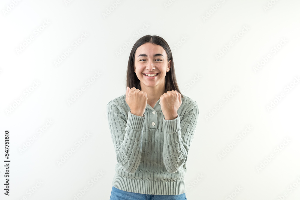 Girl happy for the victory raising her fists. Girl happy for the victory raising her fists.