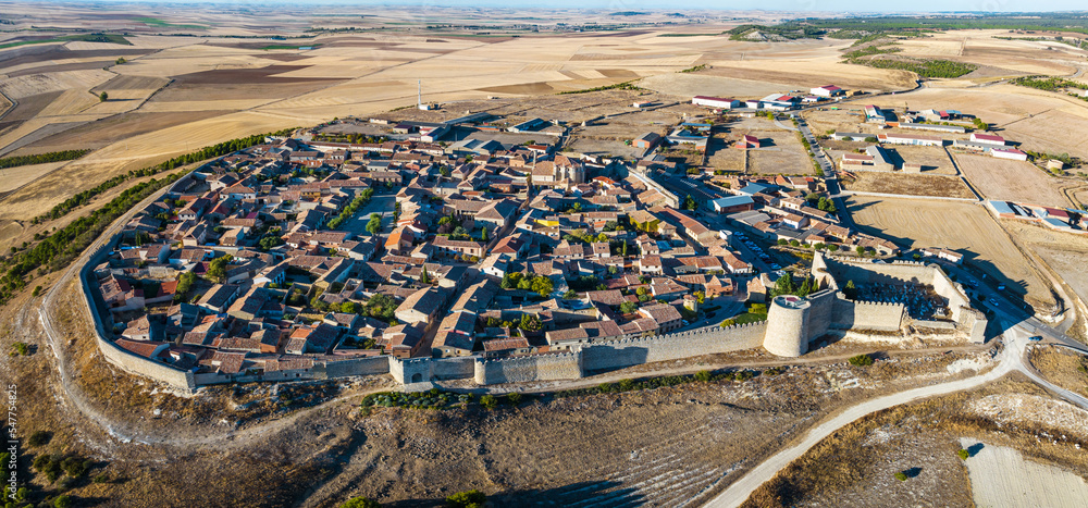 Aerial view of the Spanish medieval town of Urueña in Valladolid, with its famous walls in the foreground.