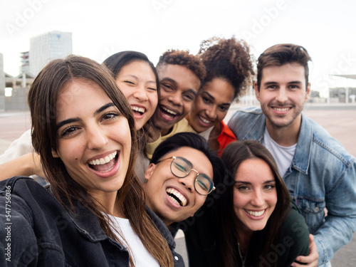 Happy diverse friendship concept with young people having fun together 